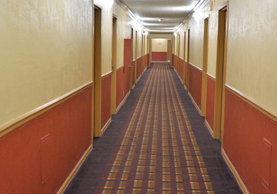 A hallway with many red and white walls